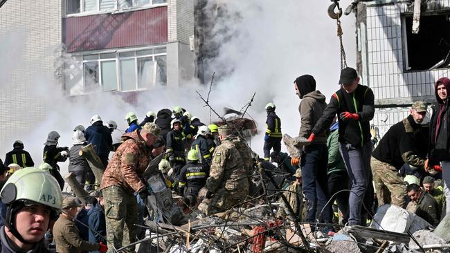 Rescuers and residents search for survivors in Uman, south of Kyiv on April 28, 2023, after Russian missile strikes targeted several Ukrainian cities overnight. Picture: AFP.