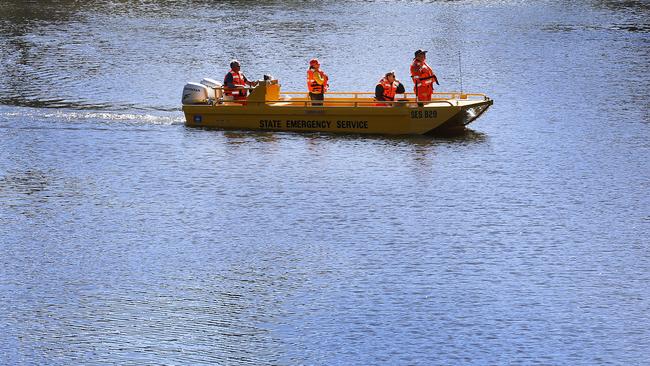 SES volunteers search the Camden Haven River in Kendall. Picture: David Moir