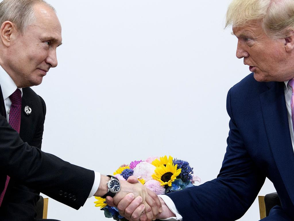 Put it there. Vladimir Putin and Donald Trump the G20 summit in Osaka, Japan in 2019. Picture: Brendan Smialowski/AFP