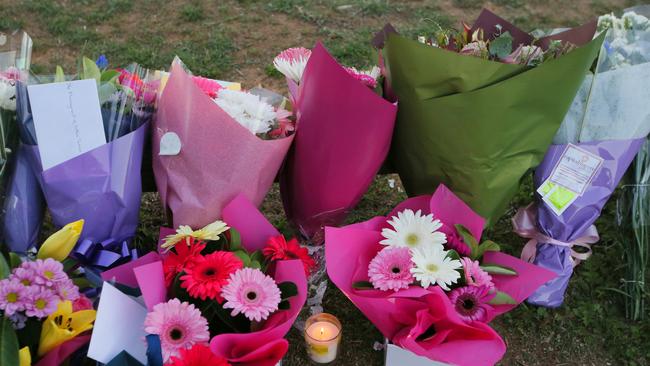 Flowers at the scene of the service station worker Zeeshan Akbar’s alleged murder. Picture: Kym Smith