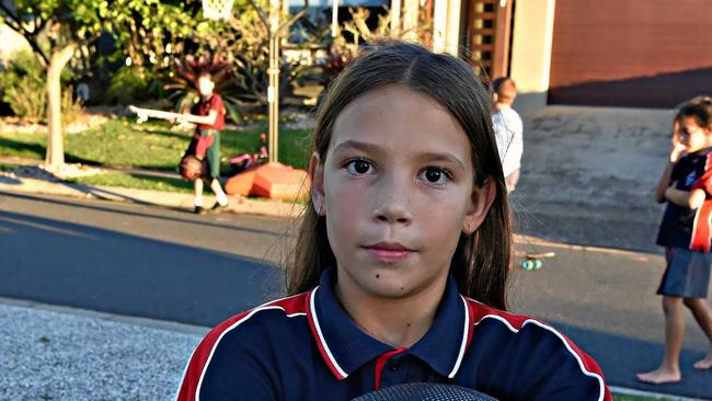 SLAM DUNK FINE: Kira Robinson, 10, uses the basketball hoop that has earned its owner a $650 fine from Sunshine Coast Council. Picture: Warren Lynam