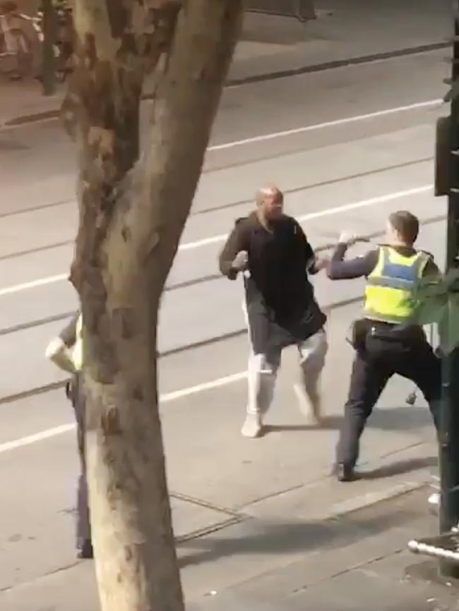 Hassan Kalif Shire Ali attacking police before he was shot.