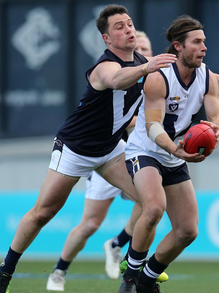 Vic Country’s Jason Cole and VAFA’s Tom Paule at Ikon Park, Carlton. Picture: Yuri Kouzmin