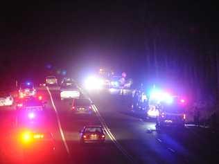 The scene of a collision between a pedestrian and a truck on the Pacific Highway at Bom Bom near Centenary Dr. Picture: Caitlan Charles