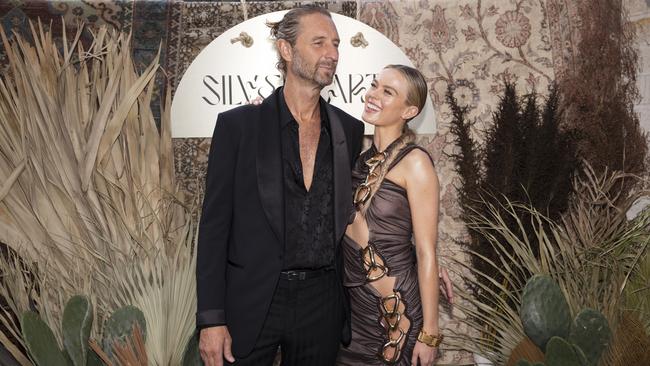 Event host Justin Hemmes and his girlfriend Madeline Holtznagel, in a daring cutaway dress. Picture: Getty Images