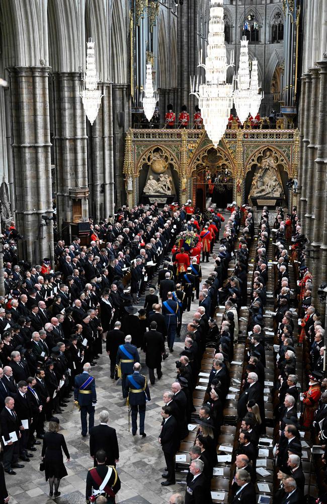 The Royal family arrives at Westminster Abbey as the coffin of Queen Elizabeth II with the Imperial State Crown resting on top is carried by the Bearer Party.