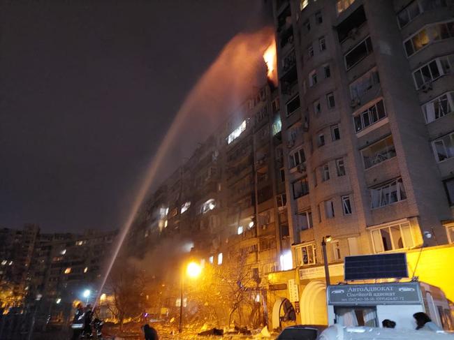 Firefighters extinguish a blaze at a damaged residential building at Koshytsa Street after it was struck by missile fragments. Picture: AFP.