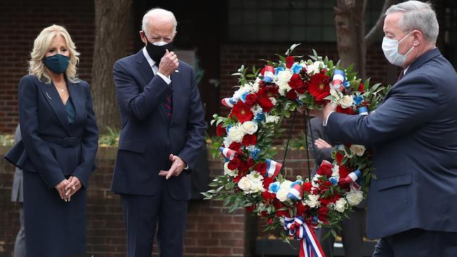 Joe Biden and Dr. Jill Biden watch as Philadelphia Mayor Jim Kenney lays a wreath to honour military veterans at the Philadelphia Korean War Memorial on Veterans Day. Picture; Getty Images.