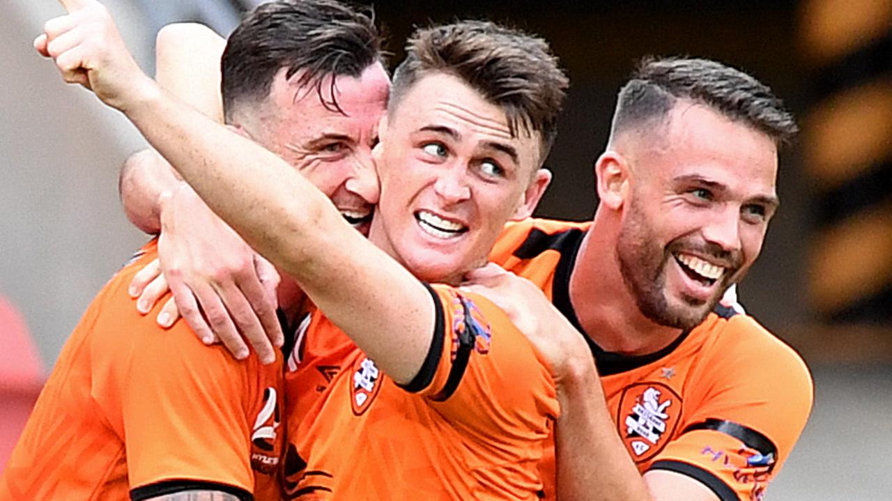 BRISBANE, AUSTRALIA - NOVEMBER 30: Roy O'Donovan of the Roar is congratulated by team mates after scoring a goal during the round eight A-League match between the Brisbane Roar and the Central Coast Mariners at Suncorp Stadium on November 30, 2019 in Brisbane, Australia. (Photo by Bradley Kanaris/Getty Images)