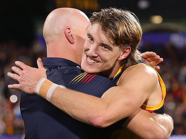 ADELAIDE, AUSTRALIA - MAY 02: Matthew Nicks, Senior Coach of the Crows embraces Josh Worrell of the Crows after the win during the 2024 AFL Round 08 match between the Adelaide Crows and the Port Adelaide Power at Adelaide Oval on May 02, 2024 in Adelaide, Australia. (Photo by Sarah Reed/AFL Photos via Getty Images)