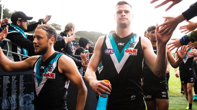 Peter Ladhams and Cam Sutcliffe leaving Adelaide Oval after the Power’s win over Sydney on the weekend. Picture: Daniel Kalisz (Getty)