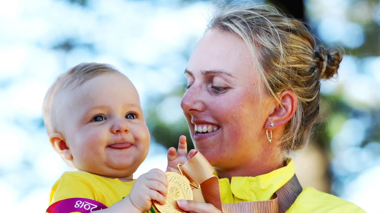 Kelsey Cottrell with her baby Sienna after winning gold at the Commonwealth Games at the Broadbeach Bowls Club.