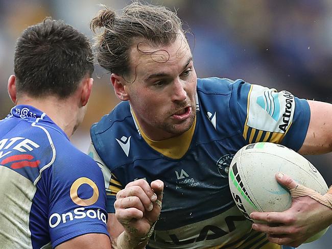 SYDNEY, AUSTRALIA - JUNE 20: Clinton Gutherson of the Eels is tackled by Jake Averillo of the Bulldogs during the round 15 NRL match between the Parramatta Eels and the Canterbury Bulldogs at Bankwest Stadium, on June 20, 2021, in Sydney, Australia. (Photo by Mark Metcalfe/Getty Images)