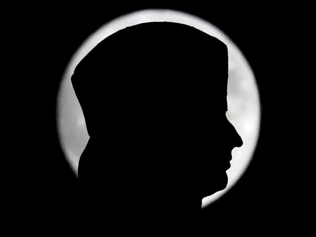 The moon is seen in its waxing gibbous stage behind the head of the Christopher Columbus statue at Columbus Circle, Sunday, Nov. 13, 2016, in New York. Picture: AP Photo/Julio Cortez