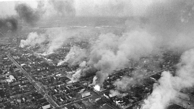 In this April 5, 1968 file photo, buildings burn along H Street in the northeast section of Washington, set afire during a day of demonstrations and rioting in reaction to the assassination of Dr. Martin Luther King Jr.