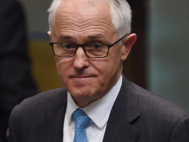 Australia's Prime Minister Malcolm Turnbull reacts during House of Representatives Question Time at Parliament House in Canberra, Wednesday, Nov. 30, 2016. (AAP Image/Lukas Coch) NO ARCHIVING