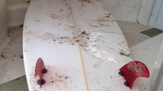 The giant bite mark left in Mr Ison’s surfboard on Friday. Picture: George Daley