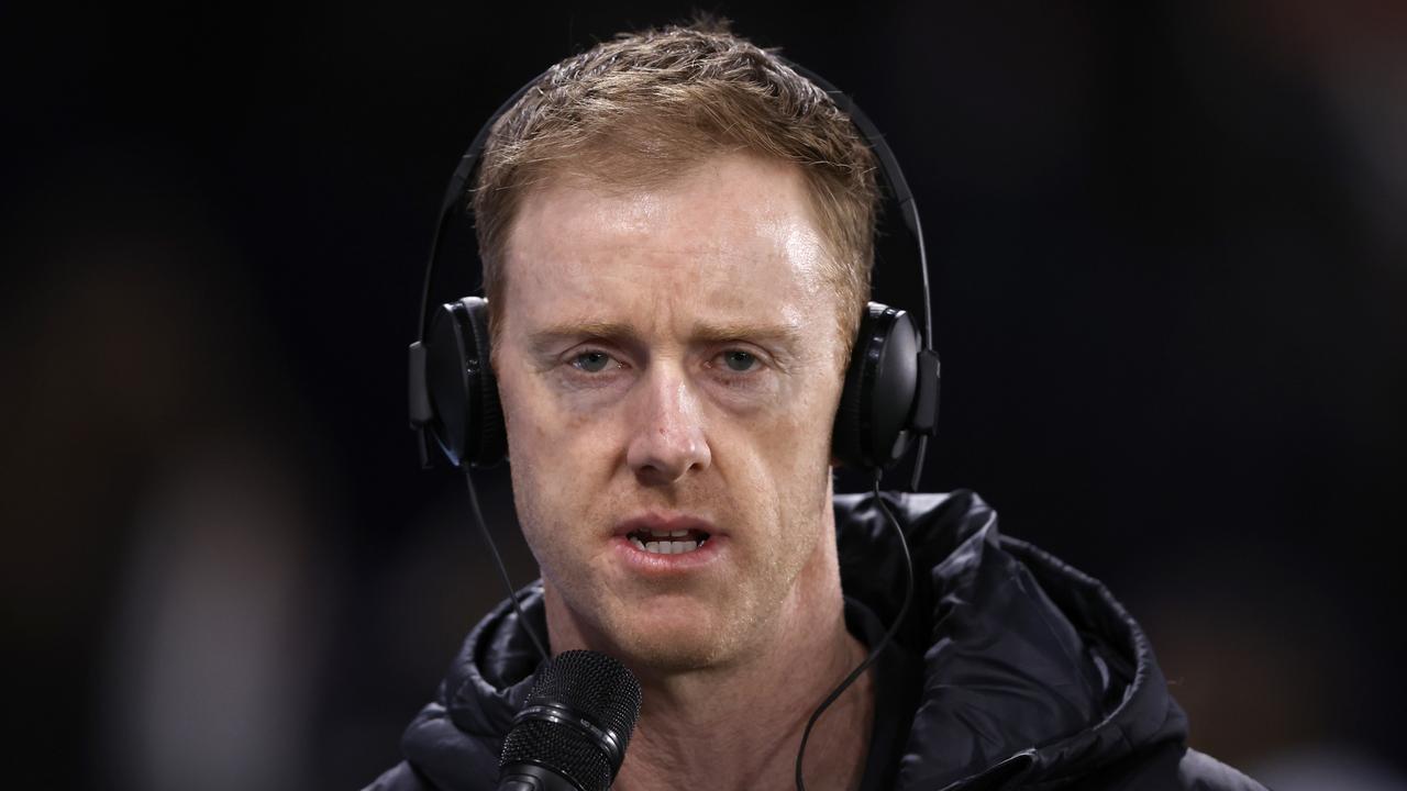 MELBOURNE, AUSTRALIA – JULY 26: Carlton assistant coach Ashley Hansen gives a radio interview before the round 20AFL match between Carlton Blues and Port Adelaide Power at Marvel Stadium, on July 26, 2024, in Melbourne, Australia. (Photo by Darrian Traynor/Getty Images)