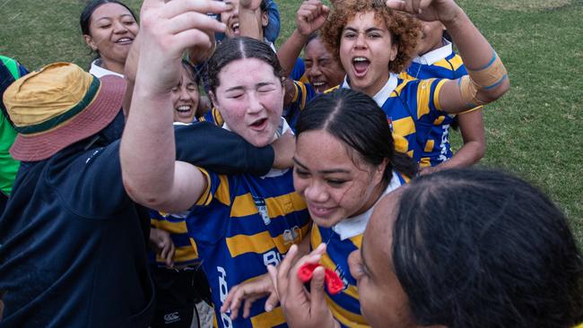 Uni Girls celebrating at the final whistle.