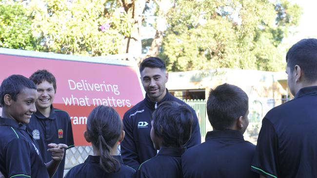 Cronulla Sharks player Shaun Johnson chats to students at Orara High School.