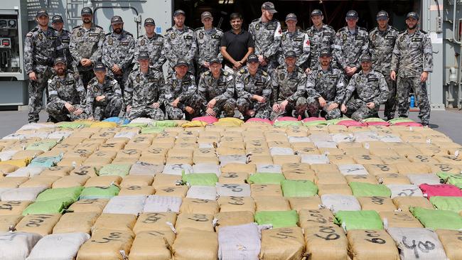 Members of HMAS Toowoomba with 5.6 tonnes of cannabis resin, worth an estimated $280 million, intercepted during a boarding in support of Operation Manitou on September 19, 2014.