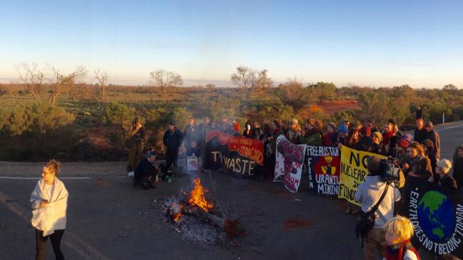 Protesters have lit a bonfire on Olympic Way, blocking traffic in and out of the uranium mine. Picture: Tait Schmaal