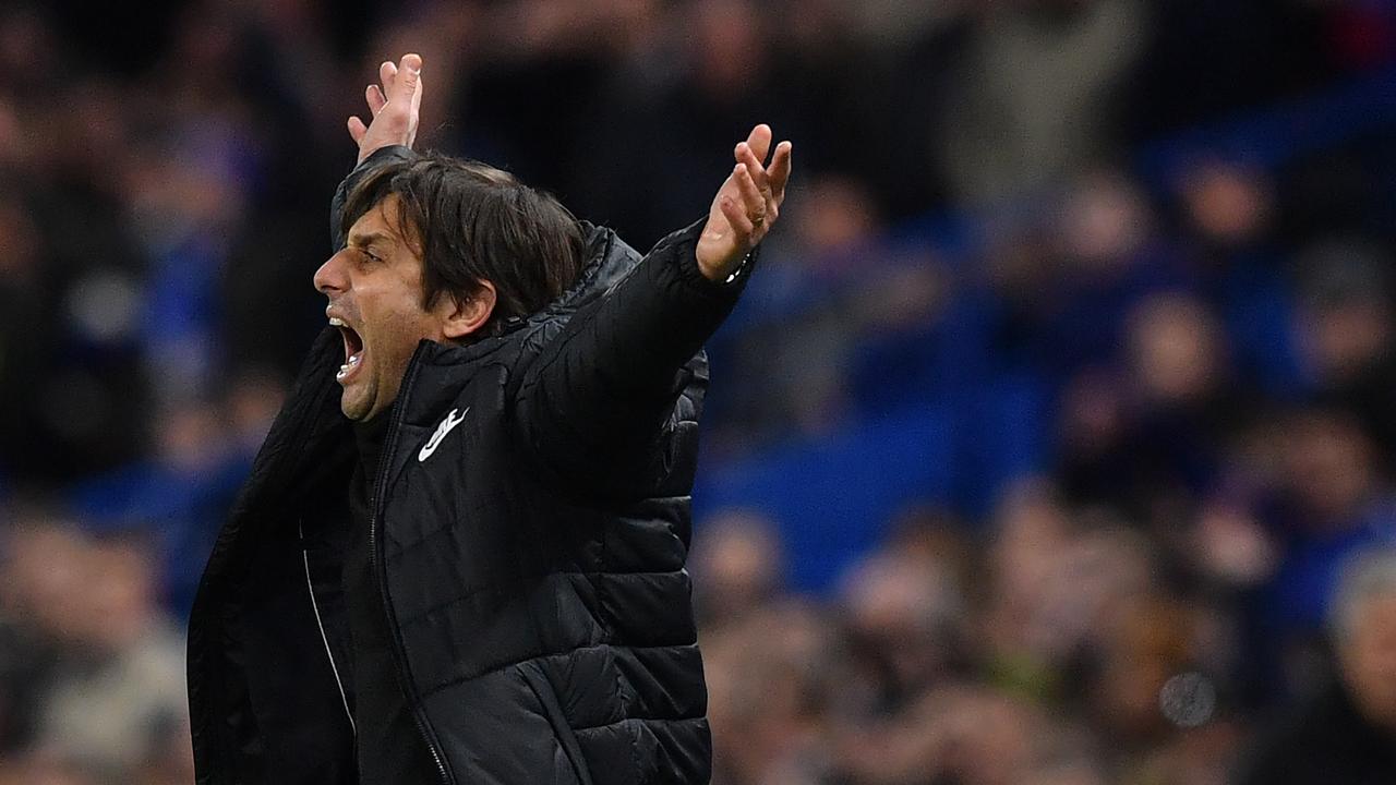 Antonio Conte gestures during the first leg of the UEFA Champions League round of 16 match between Chelsea and Barcelona.