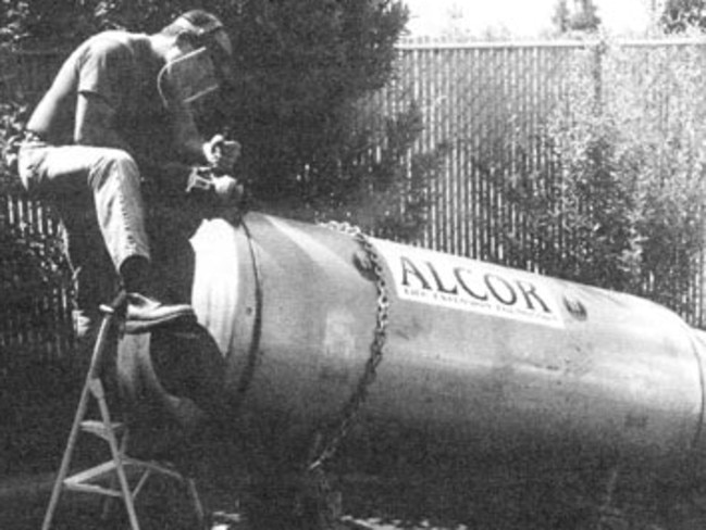 An Alcor technician cuts into the welded metal dewar holding James Bedford in 1991 before his body is examined and returned to cryogenic suspension. Picture: Alcor.