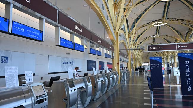 Empty United Airlines check-in counters at Washington National Airport. Picture: AFP