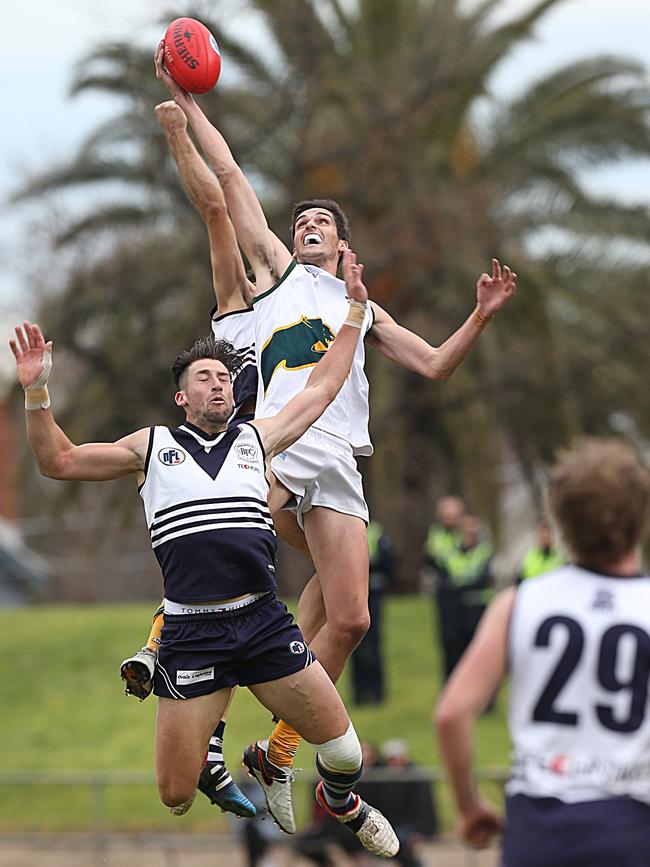 Daniel Guccione is edged under the ball by Northcote Park’s Ash Close. Picture: Ian Currie