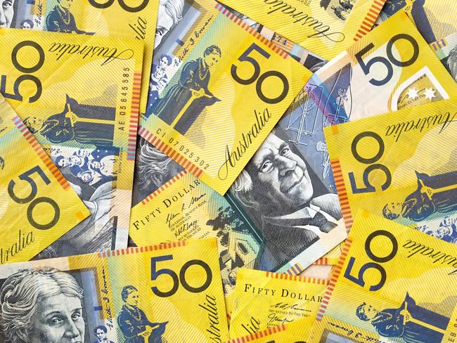 Background of Australian fifty dollar bills.  Full-frame. generic money, notes, cash.