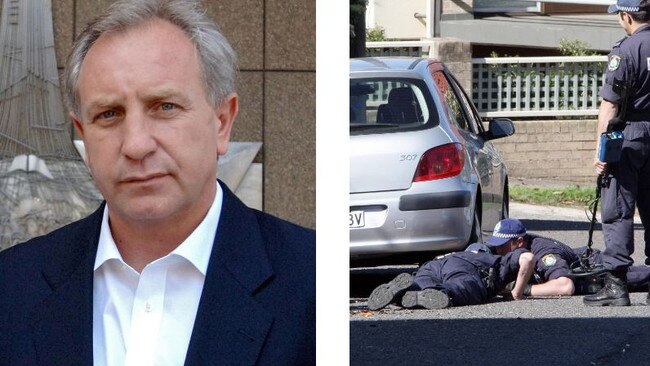 Gunned down ... Businessman Rod McGurk and police at the murder scene.