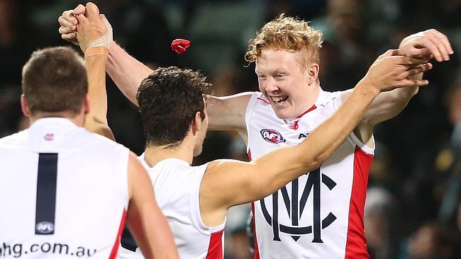 Clayton Oliver of the Demons is congratulated by team mate Christian Petracca after kicking a goal during the Round 21 AFL match between the Port Adelaide Power and the Melbourne Demons at Adelaide Oval in Adelaide, Saturday, Aug. 13, 2016. (AAP Image/Ben Macmahon) NO ARCHIVING, EDITORIAL USE ONLY