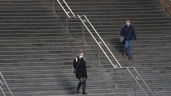 People in the deserted CBD near Southern Cross station during lockdown. Picture: NCA NewsWire / David Crosling