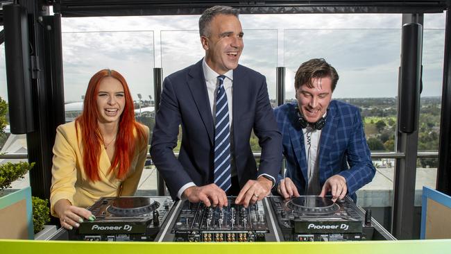 Premier Peter Malinauskas gets into the spirit of LIV golf behind the decks with Bangaz &amp; Ash DJ Duo Kai Ward and Ashlee Grindle at 2kw Bar &amp; Restaurant during an announcement regarding the 2025 event. Picture: Mark Brake