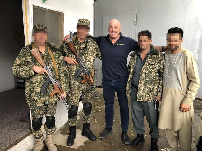 Tony Loughran with Afghan guards who were protecting a news agency compound and the first line of defence against any invading Taliban or ISIS attack.