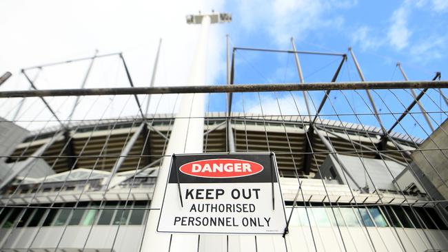 Temporary fencing is put up outside the MCG as Victoria lives through lockdown. Picture: Getty Images