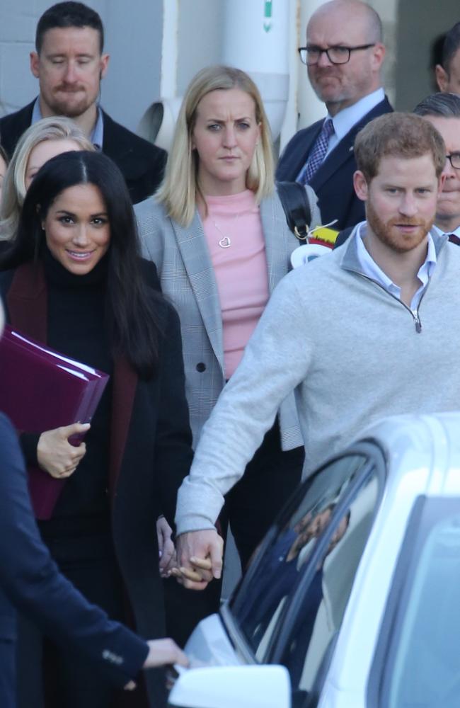 The couple held hands as they walked to their car. Credit: John Grainger