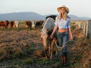 COLOSSAL TASK: Proserpine veterinary nurse Lara Mitton, with horse Goldie on Goorganga Station, says it's been a colossal task to recover from Cyclone Debbie.