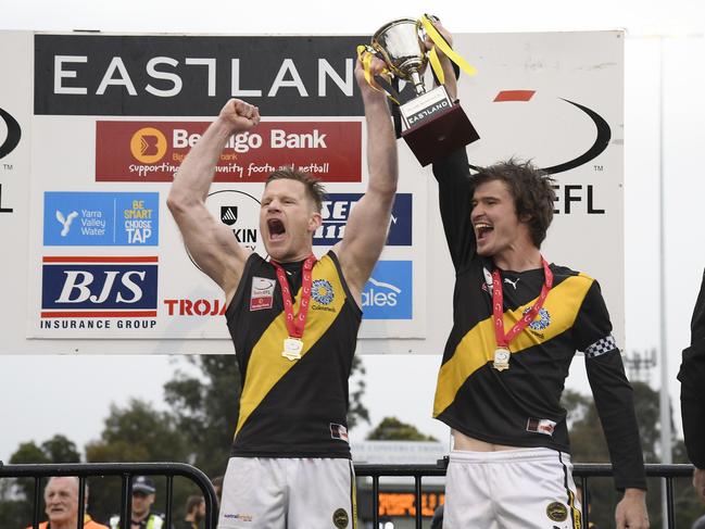 Neil Winterton and Jackson Glossop hoist the premiership cup. Picture: Andy Brownbill