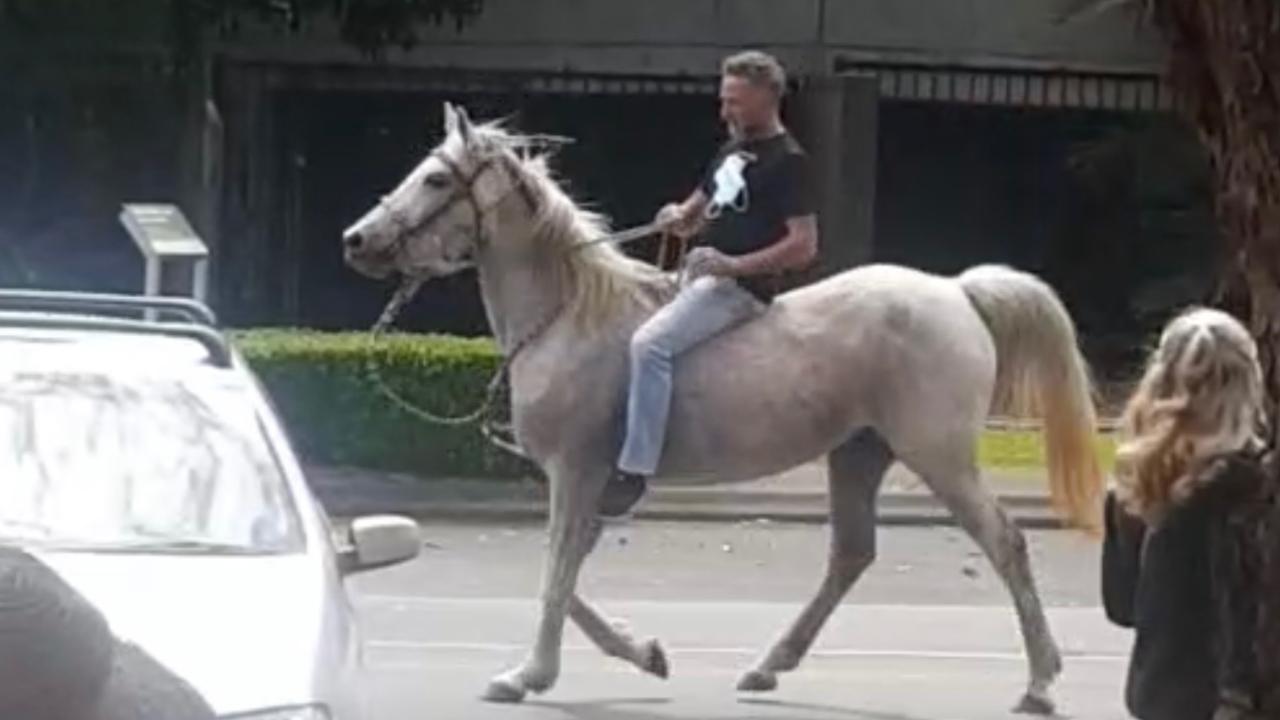 Michael Corrigan, 52, was fined by both Queensland and NSW after taking part in a rowdy demonstration at Coolangatta-Tweed Heads on August 22.