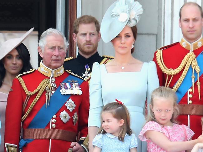 LONDON, ENGLAND - JUNE 09:  Meghan, Duchess of Sussex, Prince Charles, Prince of Wales, Prince Harry, Duke of Sussex, Catherine, Duchess of Cambridge, Princess Charlotte of Cambridge, Savannah Phillips, Prince George of Cambridge watch the flypast on the balcony of Buckingham Palace during Trooping The Colour on June 9, 2018 in London, England. The annual ceremony involving over 1400 guardsmen and cavalry, is believed to have first been performed during the reign of King Charles II. The parade marks the official birthday of the Sovereign, even though the Queen's actual birthday is on April 21st.  (Photo by Chris Jackson/Getty Images)