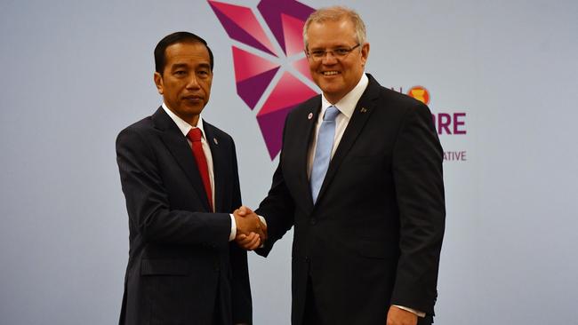 Australia's Prime Minister Scott Morrison and Indonesia's President Joko Widodo at a bilateral meeting during the 2018 ASEAN Summit in Singapore, Wednesday, November 14, 2018. (AAP Image/Mick Tsikas) NO ARCHIVING