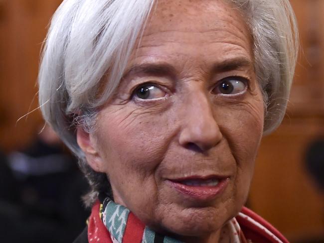 (FILES) This file photo taken on December 12, 2016 in the courtroom at the Paris courthouse shows IMF chief Christine Lagarde prior to the start of her trial before the Court of Justice of the Republic, a special tribunal used to try ministers. IMF chief Christine Lagarde goes on trial in France since December 12 over a massive state payout to a flamboyant tycoon when she was finance minister in a case that risks tarnishing her stellar career. / AFP PHOTO / Martin BUREAU