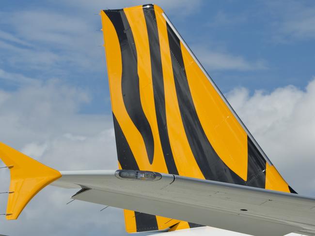 News images from TIGERAIR Ð FREE USE FOR EDITORIAL AND ONLINE USE ONLY Ð PLEASE CREDIT PICTURES BY JAMES MORGAN WHERE USED OR ISSUED Tigerair Australia celebrates its new Brisbane base which commences operations tomorrow (11 March 2014). Pictured: Tigerair CEO Rob Sharp (ON WING OF THE AIRBUS A320), Queensland Minister of Tourism and Major Events, the Hon Jann Stuckey and new cabin crew and pilots which will be based in Brisbane at a media event today at Brisbane Airport. Two new A320 aircraft will call Brisbane home providing 200 jobs (over 130 jobs in Brisbane), 800,000 additional domestic seats and five new routes. FOR FURTHER INFO CONTACT: Vanessa Regan head of communications, commercial department tiger airways australia pty ltd mobile: (+61) 0409 200 229