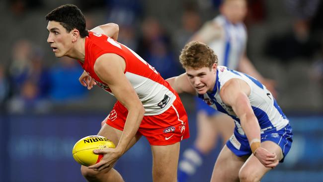 Justin McInerney of the Sydney Swans and North Melbourne’s Tom Powell in action at the weekend. Picture: Michael Willson/Getty Images