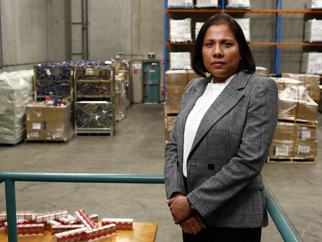 The world’s first Illicit Tobacco and E-Cigarette Commissioner Erin Dale with a warehouse full of seized tobacco and vapes. Picture: Jonathan Ng