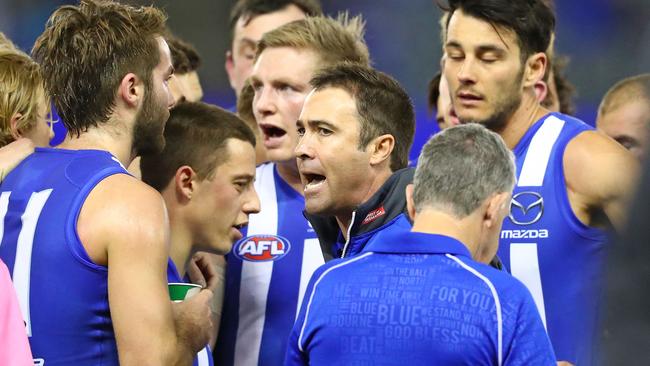 Brad Scott talks to his players during the clash against Fremantle.