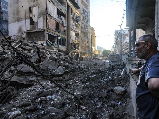 A resident stares at the destruction in the aftermath of an Israeli strike on the neighbourhood of Mreijeh in Beirut's southern suburbs on October 4, 2024. A source close to Hezbollah said Israel had conducted 11 consecutive strikes on the group's south Beirut stronghold late on October 3, in one of the most violent raids since Israel intensified its bombardment campaign last week. (Photo by AFP)