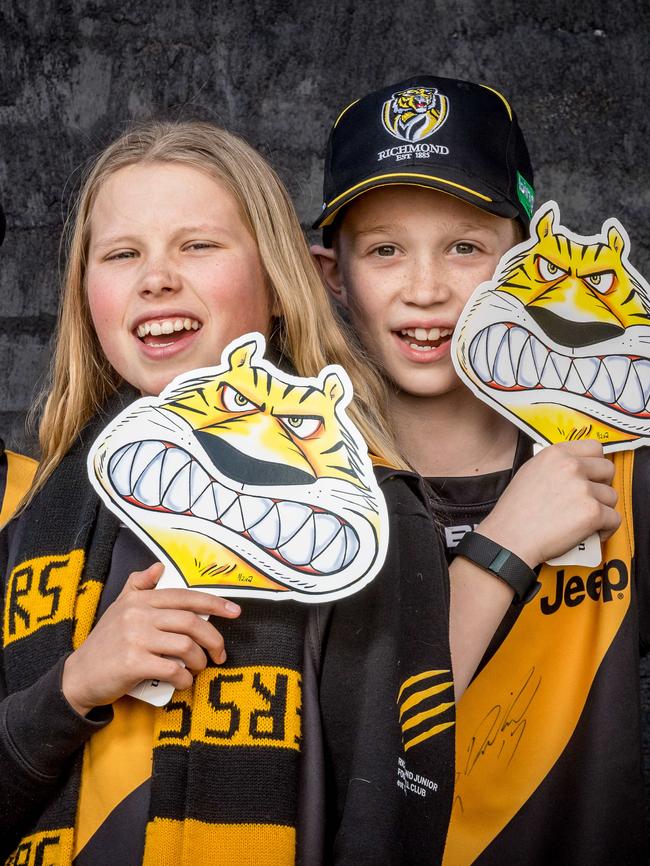 Tiger masks. Thomas Ballek, 11, Anna Boterham, 13 and Alexander Grant, 11 hold Herald Sun Tiger masks. Picture: Jake Nowakowski